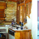 Dec., ’99, old oven, bathroom, old yellow toilet & sink, right, closet.
