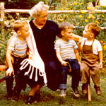 1956, 3 boys & Aunt Beck, Mom family, back yard.. 