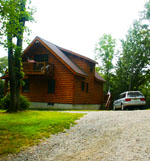 Clumbing to top of new Cabin, summer, 2000, me and dog,Spike! But, 2003, summer, rent new cabin..