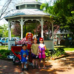 Gazebo, clown suit & 3 children, Chestnut Avenue and Centre Street